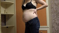 Pregnant milf takes off her tight jeans, puts on a sexy outfit, and masturbates her hairy pussy with a dildo. Homemade fetish and juicy booty with a hairy asshole. Thumb
